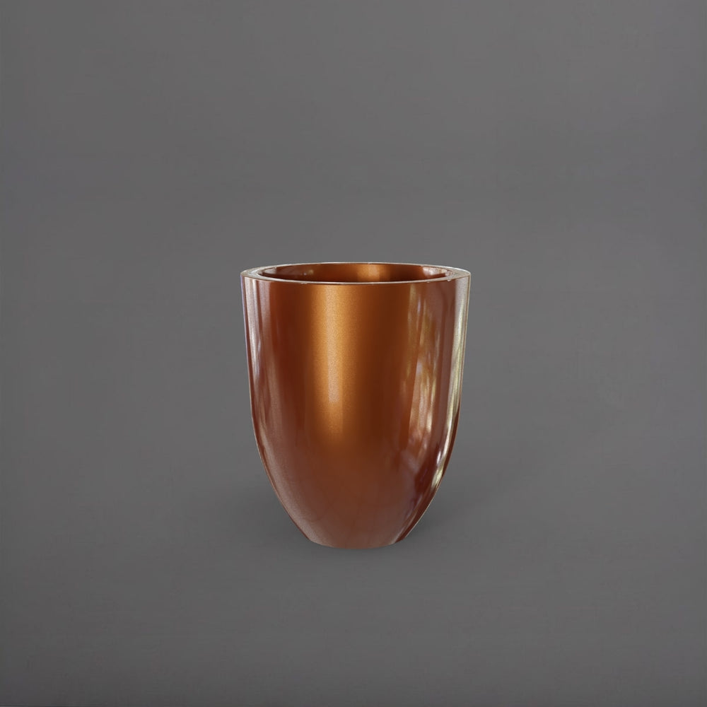 Valencia Tapered Round Fiberglass Planter in metallic bronze against gray background.