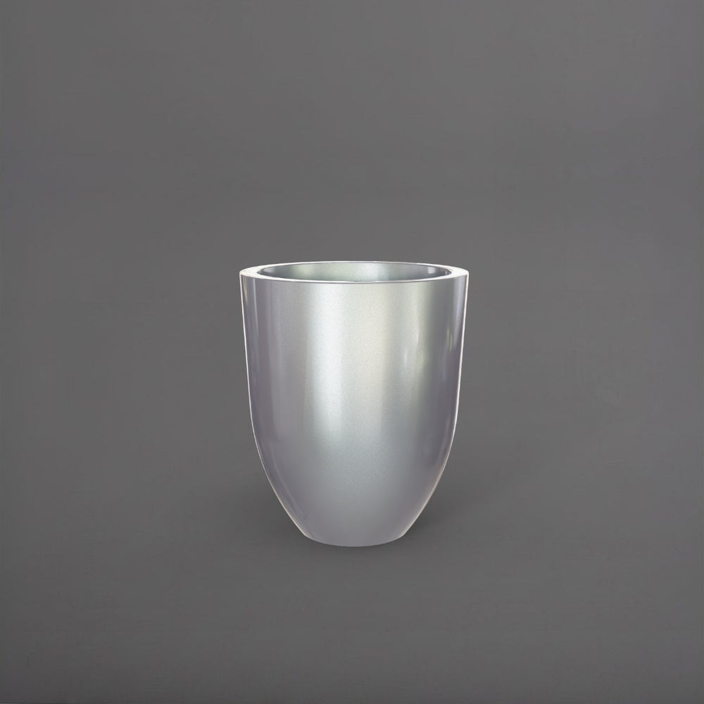 Valencia Tapered Round Fiberglass Planter in metallic silver against gray background.