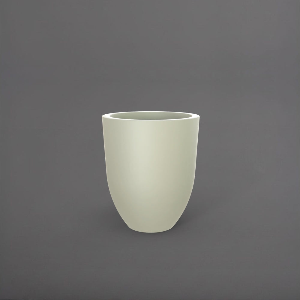 Valencia Tapered Round Fiberglass Planter in satin beige against gray background.