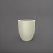 Valencia Tapered Round Fiberglass Planter in satin beige against gray background.
