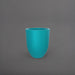Valencia Tapered Round Fiberglass Planter in satin seafoam green against gray background.