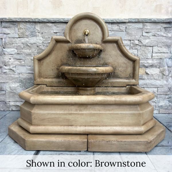 Venasque Wall Fountain in Brownstone color against concrete wall.