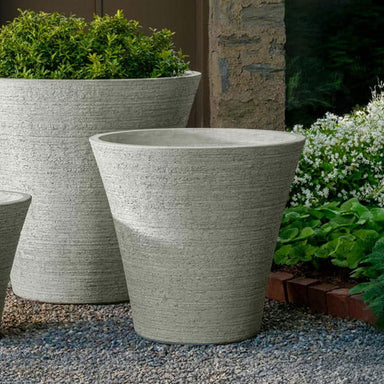 Verve Planter on gravel in the backyard.