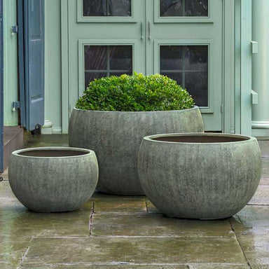 Wakefield Planter, Large - Verdigris Lite on concrete filled with  plants