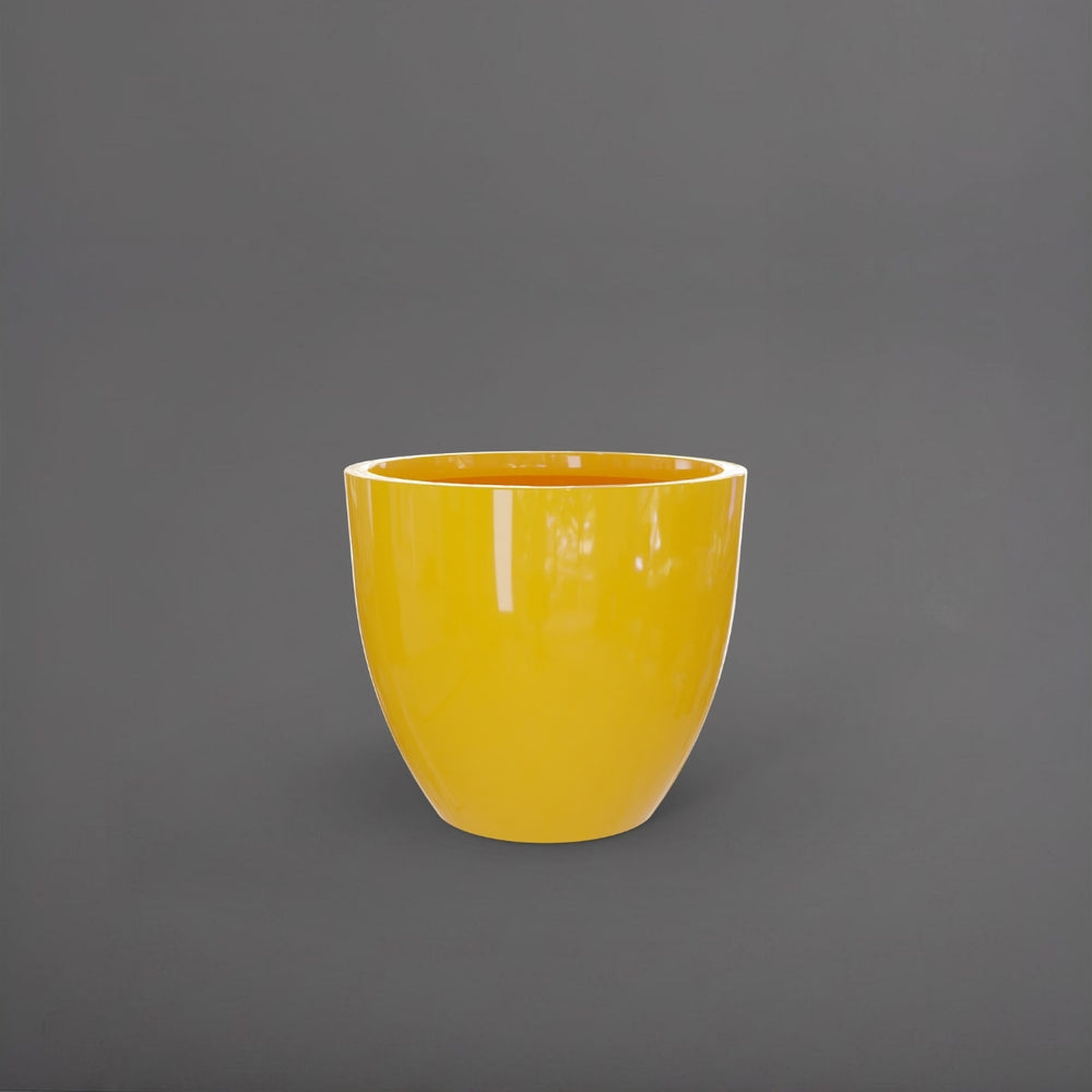 Wannsee Extra Large Round Fiberglass Planter in gloss saffron against gray background.