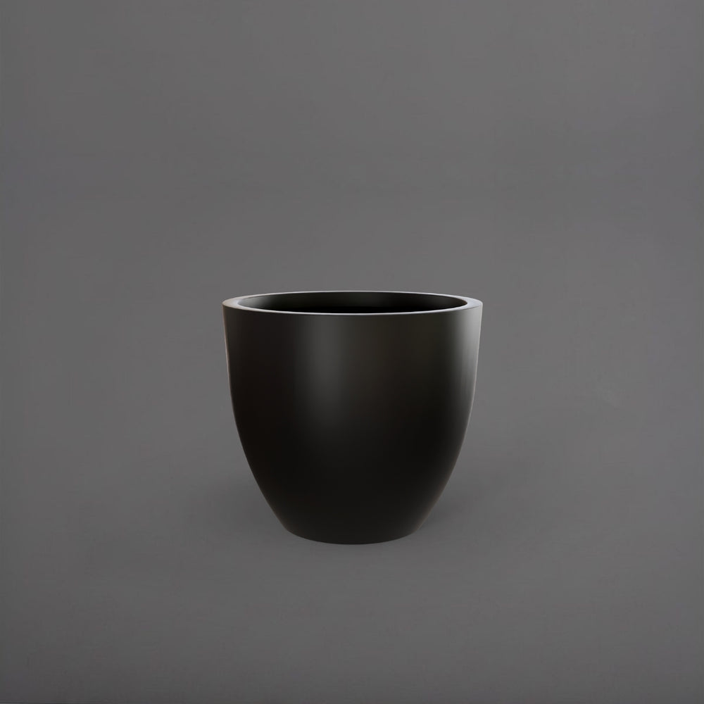Wannsee Extra Large Round Fiberglass Planter in matte black against gray background.