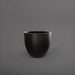 Wannsee Extra Large Round Fiberglass Planter in matte black against gray background.