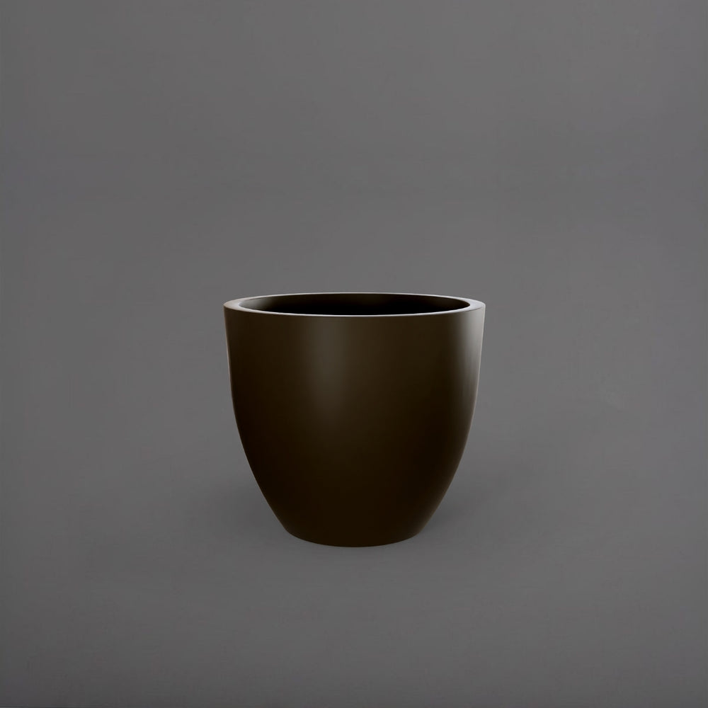 Wannsee Extra Large Round Fiberglass Planter in matte bronze against gray background.