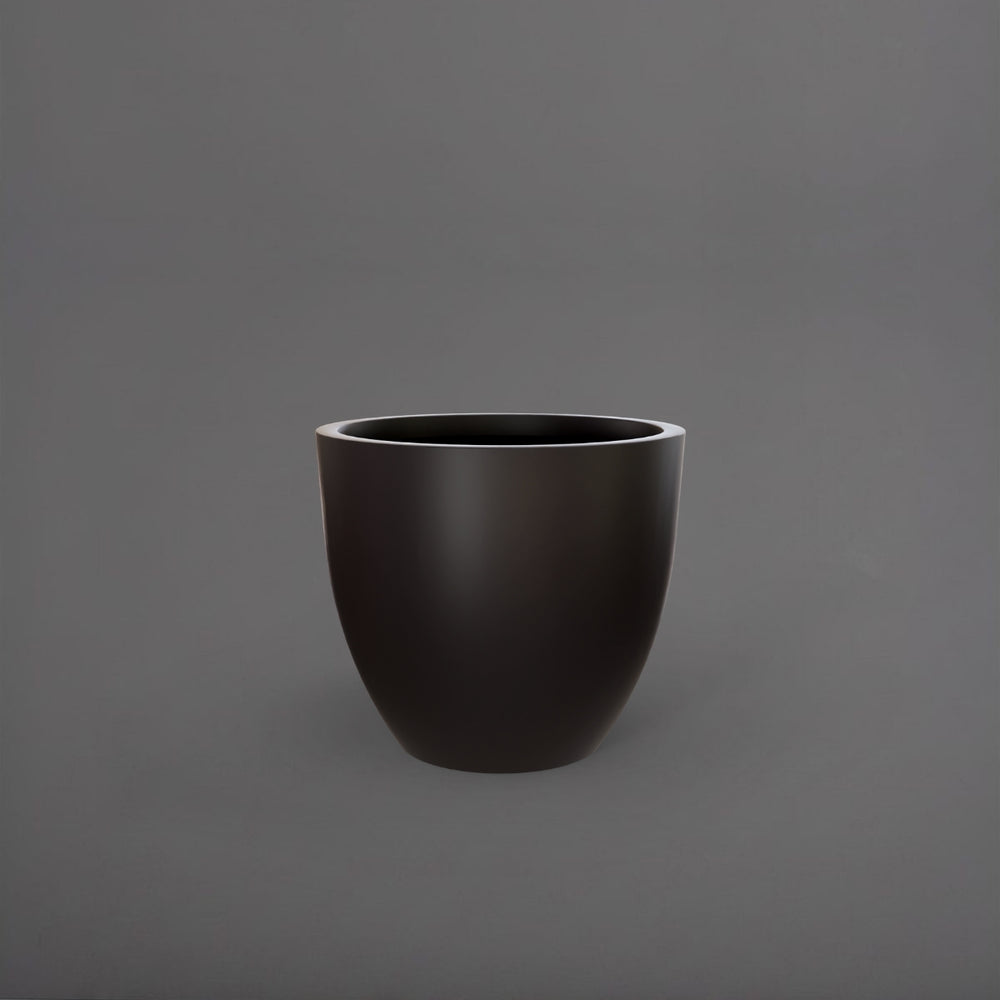 Wannsee Extra Large Round Fiberglass Planter in matte charcoal against gray background.