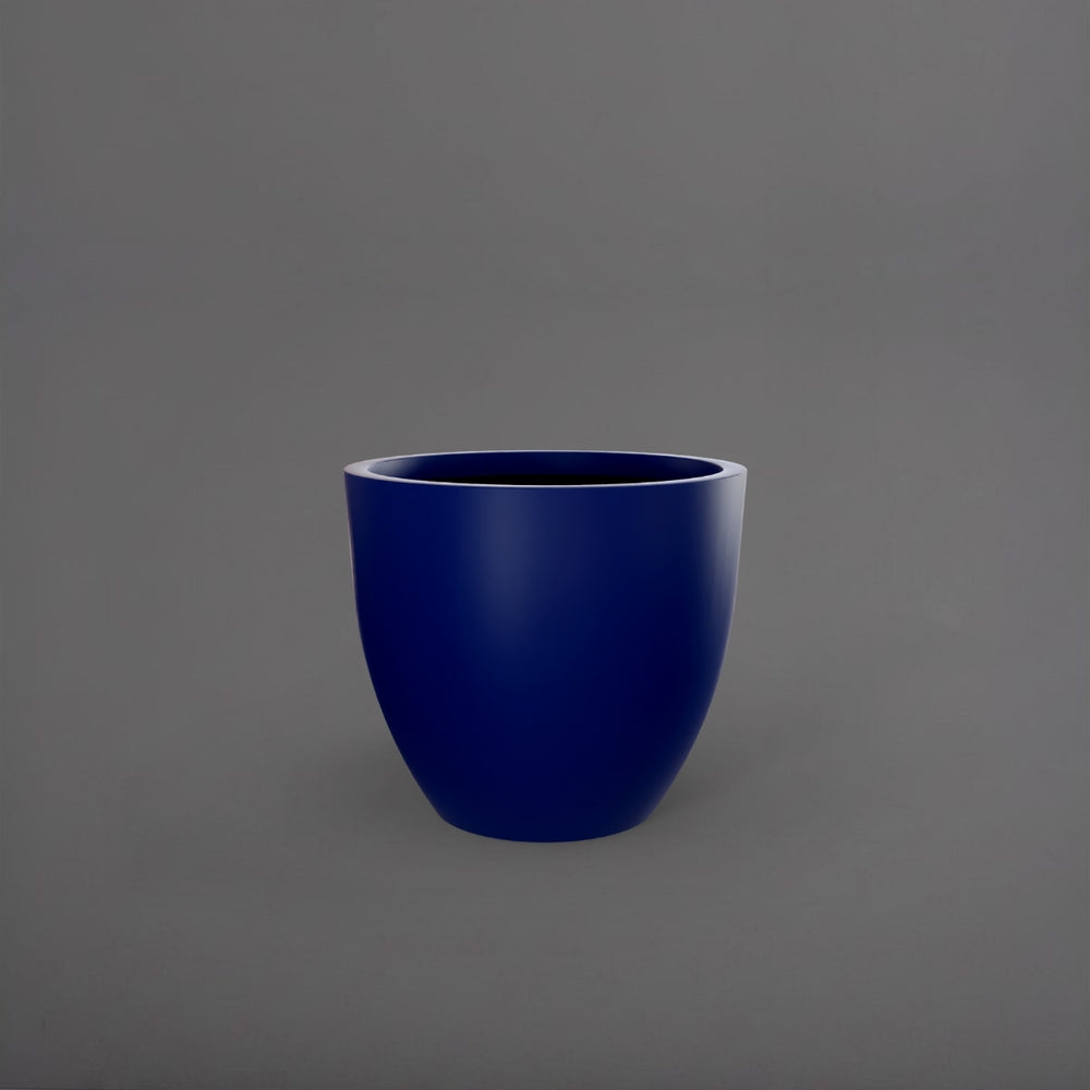 Wannsee Extra Large Round Fiberglass Planter in matte cobalt blue against gray background.