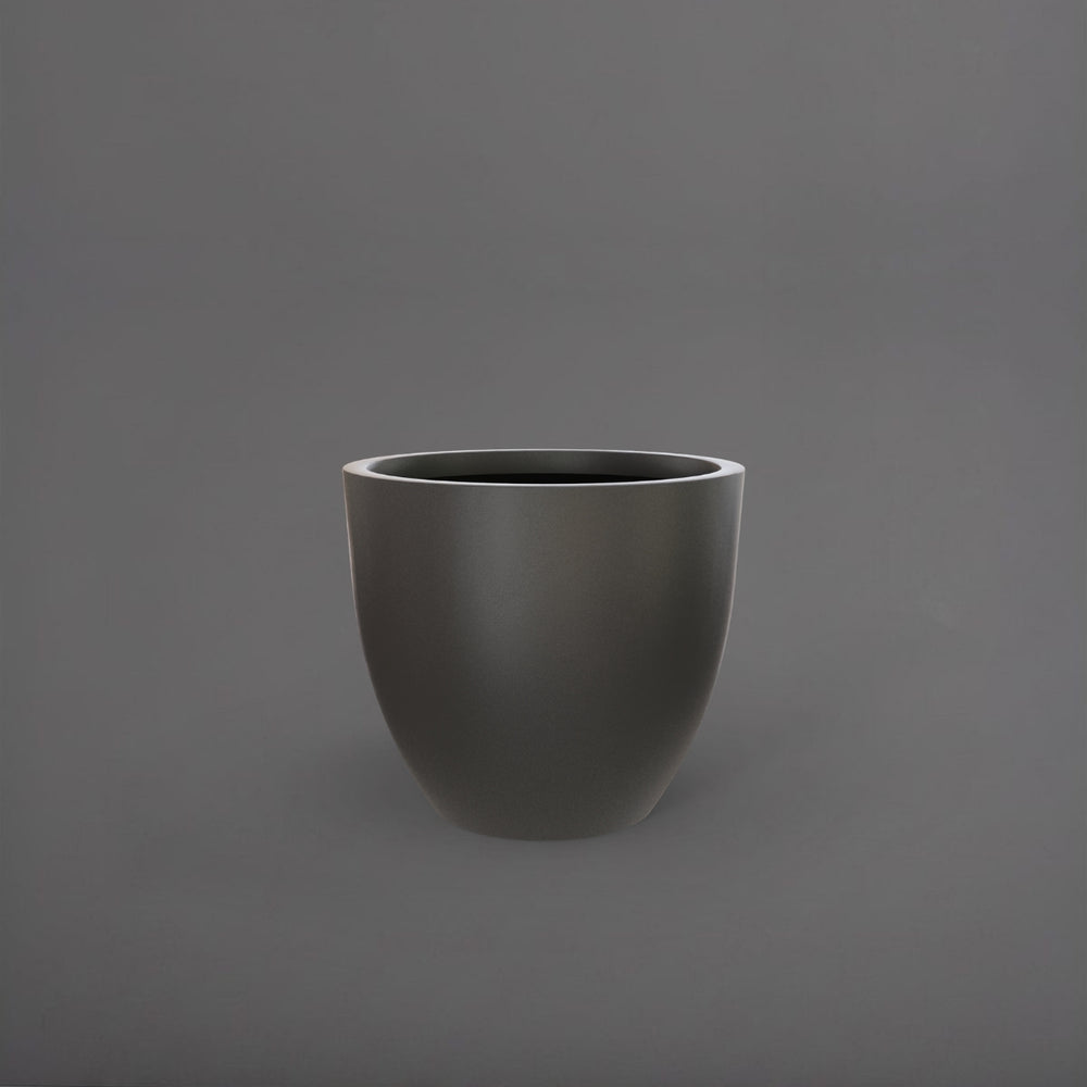 Wannsee Extra Large Round Fiberglass Planter in matte gunmetal against gray background.