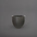 Wannsee Extra Large Round Fiberglass Planter in matte gunmetal against gray background.