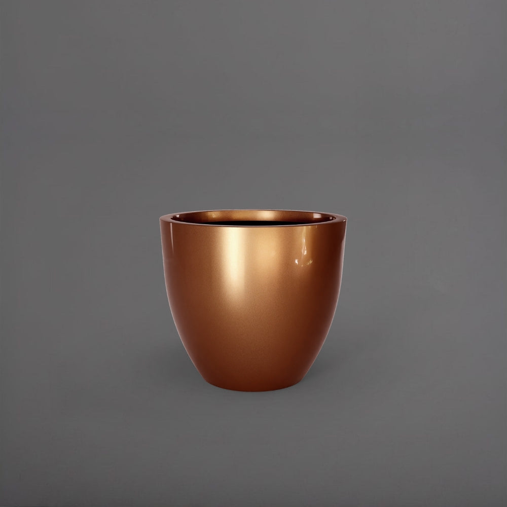 Wannsee Extra Large Round Fiberglass Planter in metallic bronze against gray background.