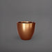 Wannsee Extra Large Round Fiberglass Planter in metallic bronze against gray background.