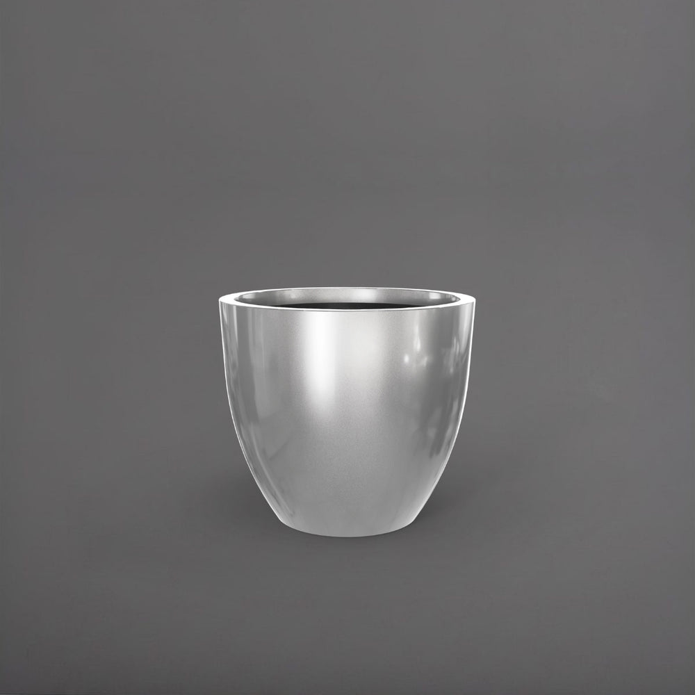 Wannsee Extra Large Round Fiberglass Planter in metallic silver against gray background.