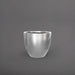 Wannsee Extra Large Round Fiberglass Planter in metallic silver against gray background.