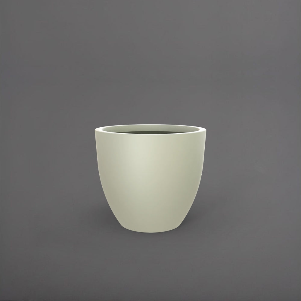Wannsee Extra Large Round Fiberglass Planter in satin beige against gray background.