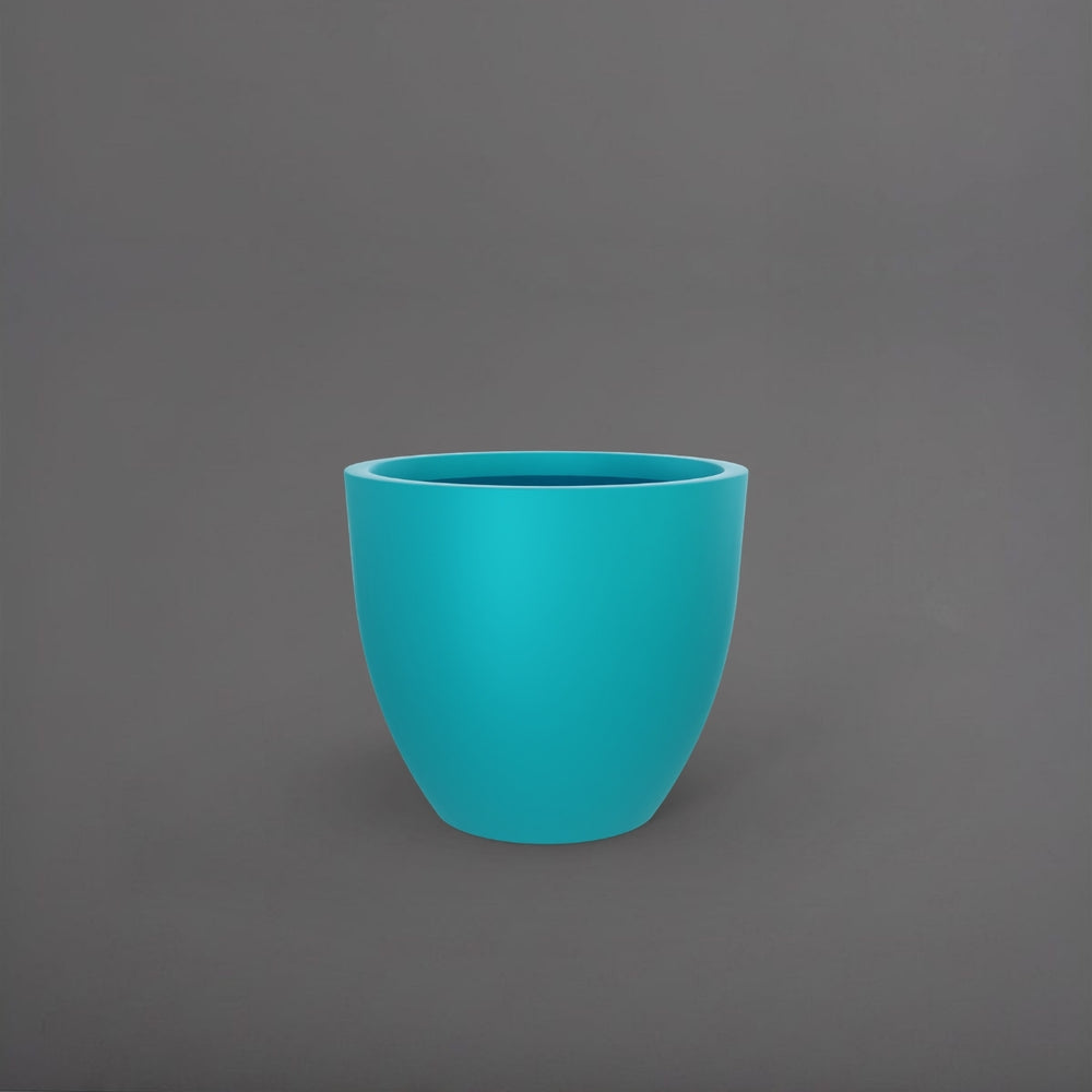 Wannsee Extra Large Round Fiberglass Planter in satin seafoam green against gray background.