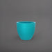 Wannsee Extra Large Round Fiberglass Planter in satin seafoam green against gray background.