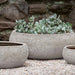 Zaha Planter - Angkor Light Grey - S/3 on gravel filled with plants