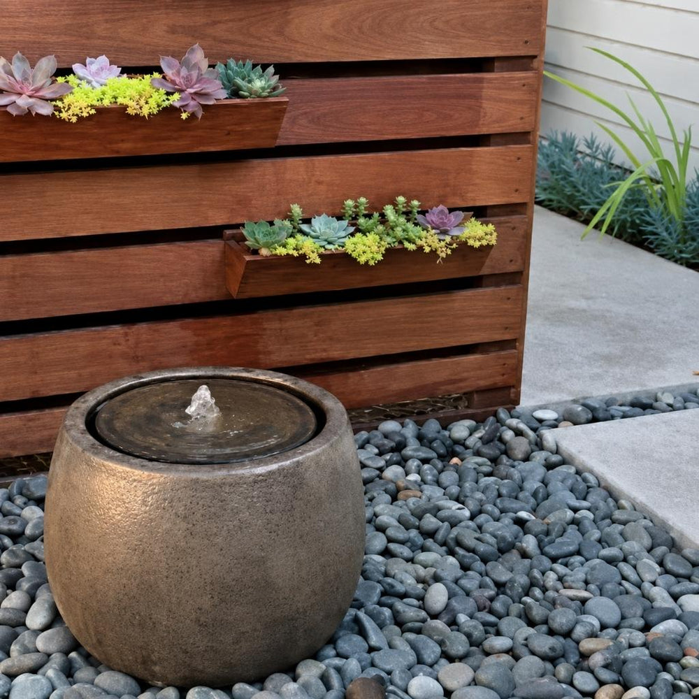 boden fountain bronze on gray rocks running