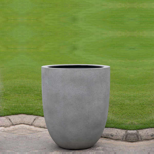 Bradford Extra Small Planter Stone Grey Lite S/1 on concrete in the backyard