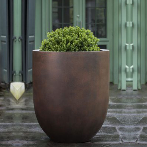 Bradford Planter, Medium - Rust Lite - S/1 on concrete filled with plants