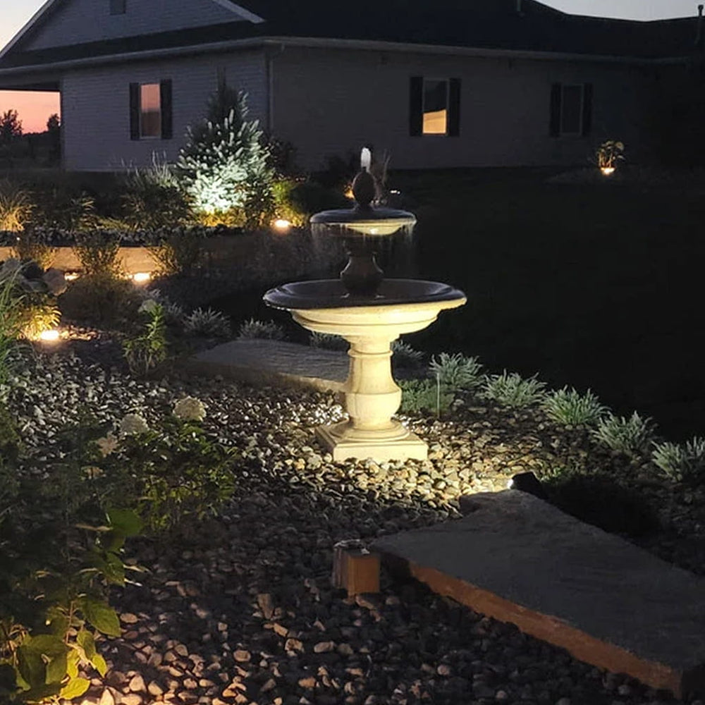 Campania caterina fountain in rock garden at night running