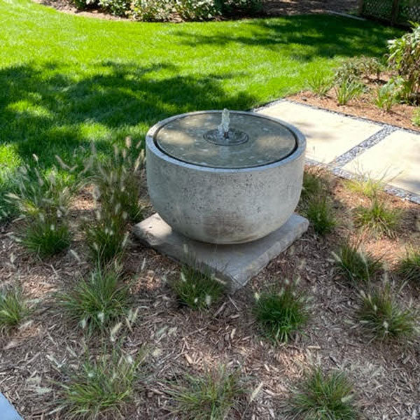 Campania International Echo Park Fountain surrounded by plants in backyard