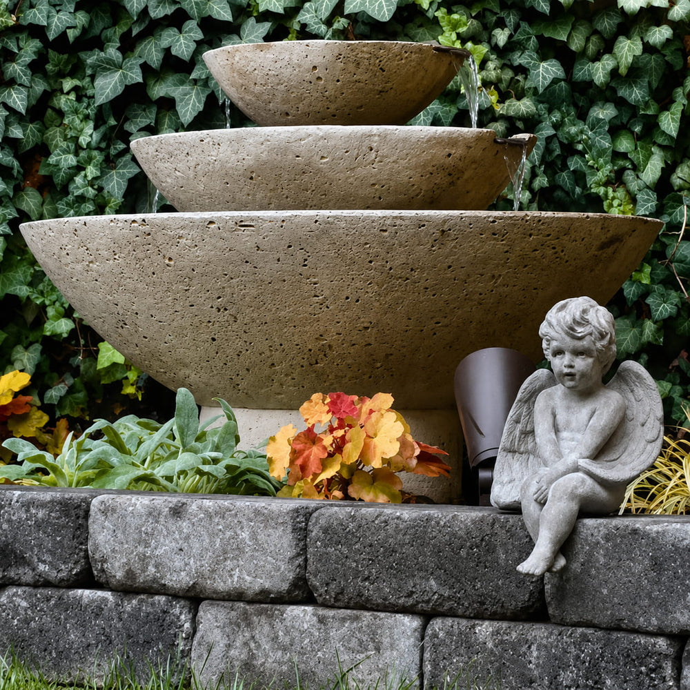 Carrera Oval Fountain running with green ivy backdrop