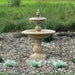 Caterina fountain on gravel in backyard running