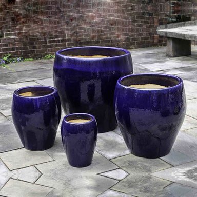 Chantal Planter - Sapphire - Set of 4 on concrete in the backyard