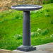 Classic Column Birdbath on concrete in the backyard