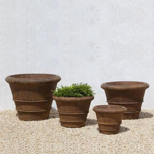 Classic Rolled Rim  20.75″ Planter on gravel in the backyard