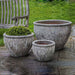 Corfu Planter - Angkor Grey - Set of 3 beside a chair in the backyard