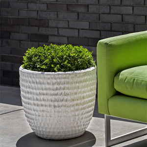 Dimple Glaze Planter S/3 Antique White beside green chair in the backyard