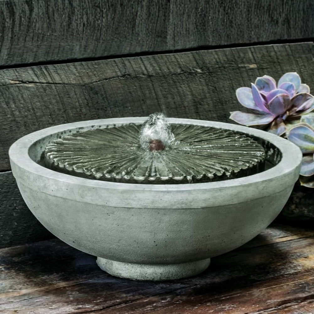 Equinox Garden Terrace Fountain on table beside cactus