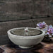 Equinox Garden Terrace Fountain on table beside cactus