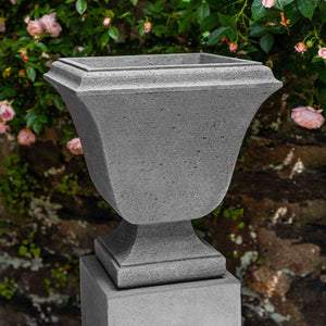 Extra Small Trowbridge Urn against pink flowers in the backyard