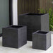 Farnley Planter 1818 - Charcoal Premium Lite S/1 on patio near green plants