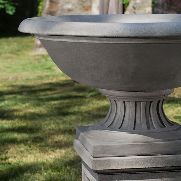 Fonthill Urn on pedestal in the backyard upclose