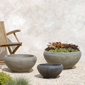 Giulia Large Planter on gravel near a wooden chair