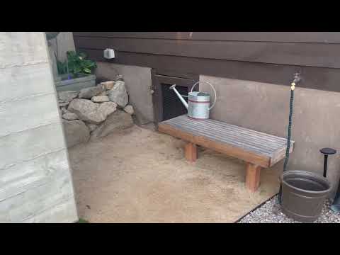 Campania Austin Fountain in action in big boulder rock garden