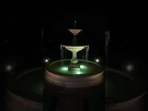 Charleston fountain in basin with LED lights at night in action