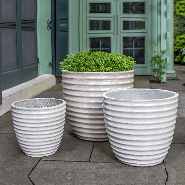 Linea Planter Pearl S/3 filled with plans in the backyard