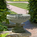 Longwood Laurel Banded Urn on ledge in the backyard