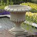Longwood Main Fountain Garden Urn on stone bricks in the backyard.