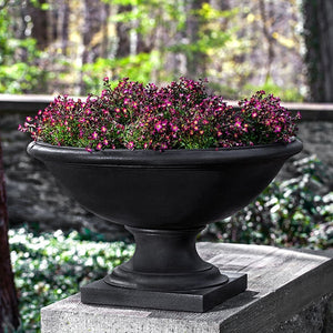 Low Savannah Urn filled with flowers in the backyard