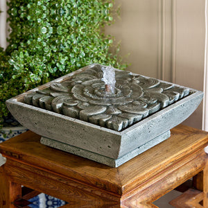  M-Series Artifact Fountain on table against green plants