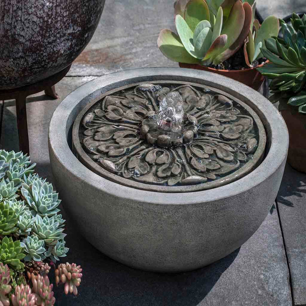 M-Series Medallion Fountain on concrete beside cactus